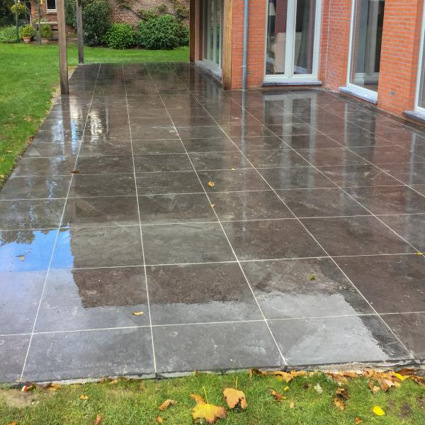 Bonheiden - Aanleg terras in blauwe natuursteen 60x60 en 60m²